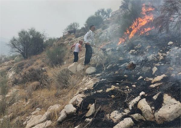 اطفاء حریق در کوهستانهای اطراف منطقه عملیاتی آغار و دالان 7