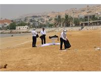 پاکسازی ساحل خلیج همیشه فارس توسط کارکنان منطقه عملیاتی نار و کنگان 18